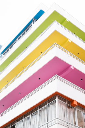 Vertical shot of a building with colorful balconies